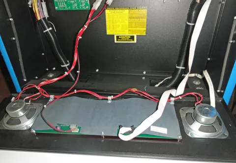 Behind Speakers and Display Panel