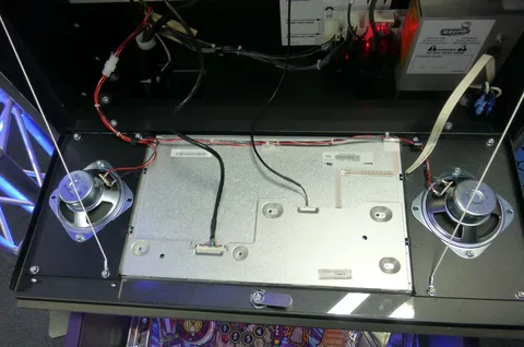Behind Speaker and LCD Panel*